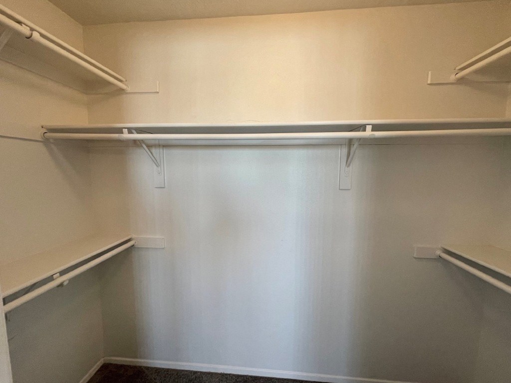 Empty white shelves in a room.